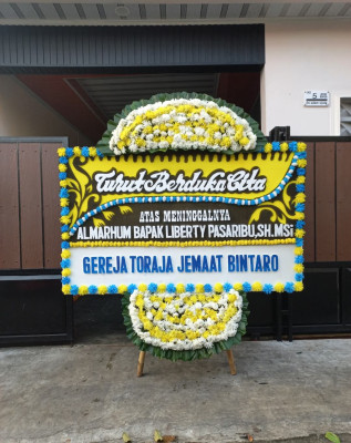 Papan Bunga Duka di Sintung